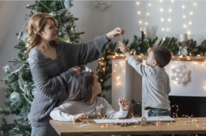 mother-children-decorating-a-gift